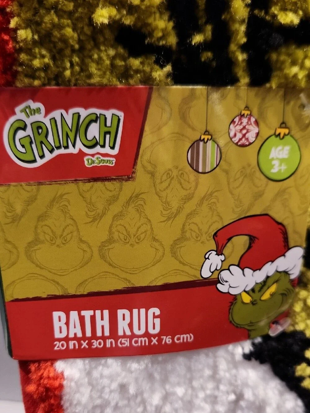 Dr. Seuss The Grinch White & Red Plush Bath Mat with Yellow Motif